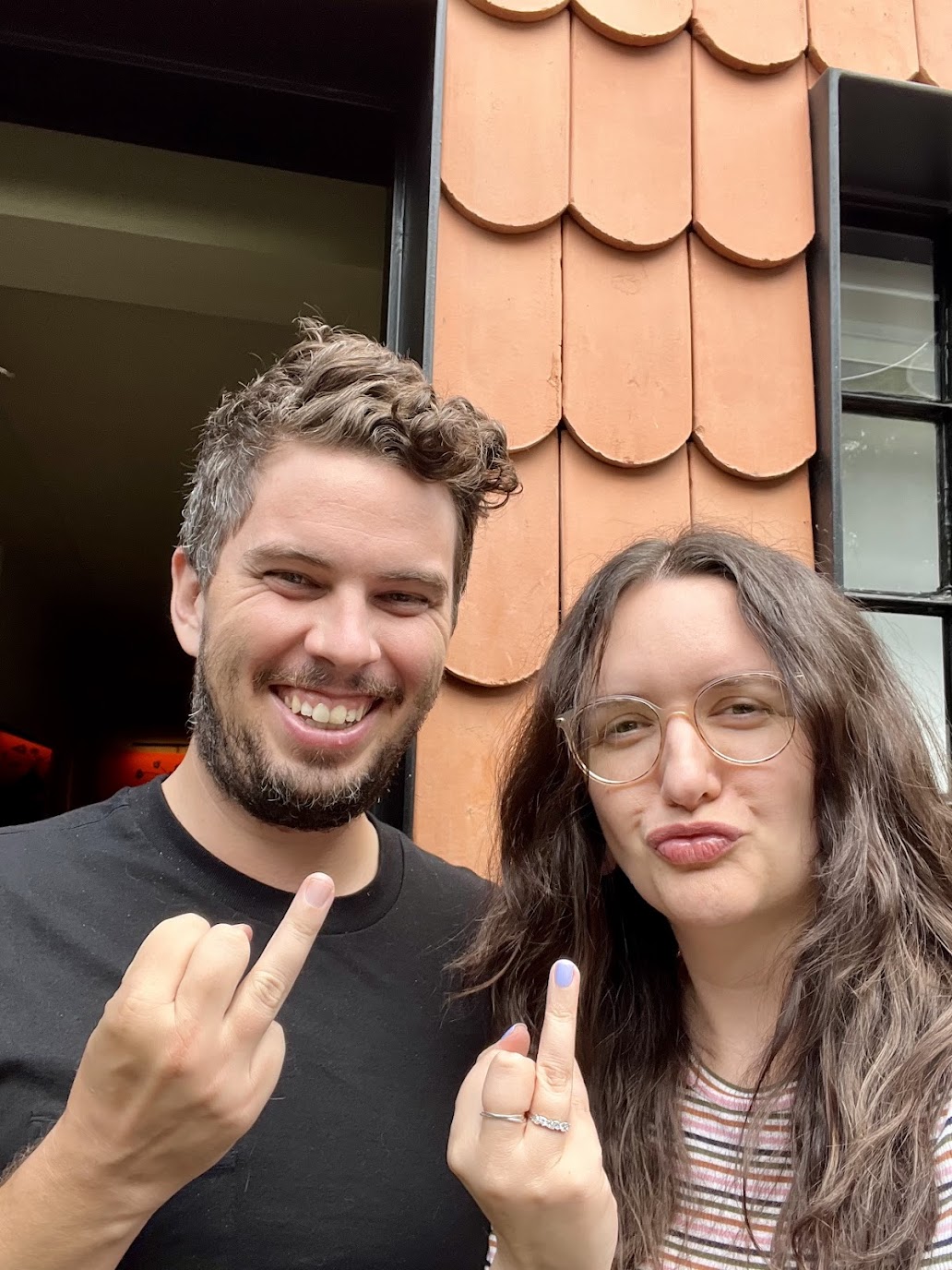 Jason and Ashley with raised ring fingers