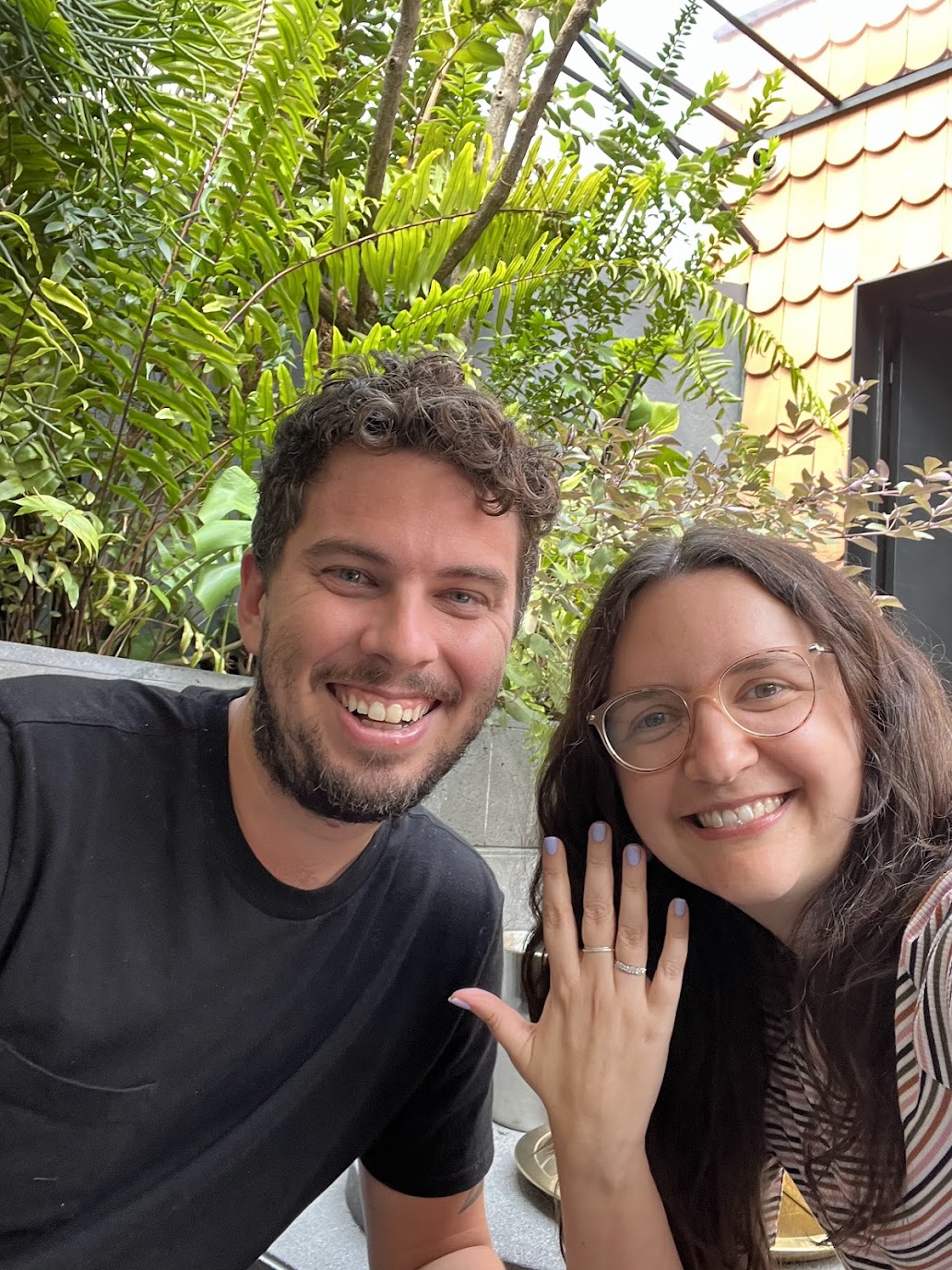 Jason and Ashley smiling and showing off the ring